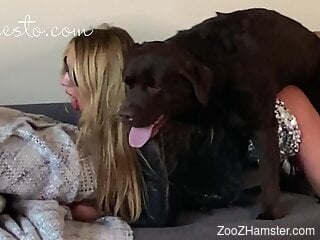 Sexy blonde moans and masturbates while the dog licks her muff